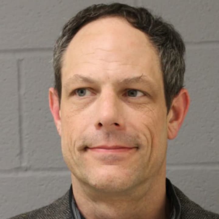 Jason Adams, a 46-year-old science teacher, was arrested with a loaded gun inside Newtown Middle School.