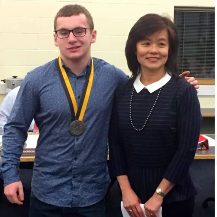 Benjamin Zangola received a medallion from Prudential Financial Advisor Lily Lam