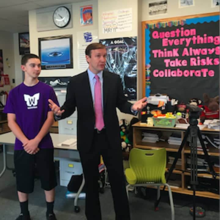 U.S. Sen., Chris Murphy, D-Conn., speaks at New Fairfield Middle School about the Wingman program. Beside him is student Tyler Lent, one of the participants in the program that encourages dialogue and respect among students.