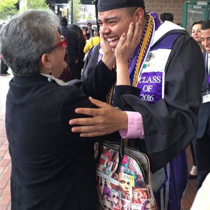 A University of Bridgeport graduate hugs his mom after the commencement ceremony on Saturday at the Webster Bank Arena.