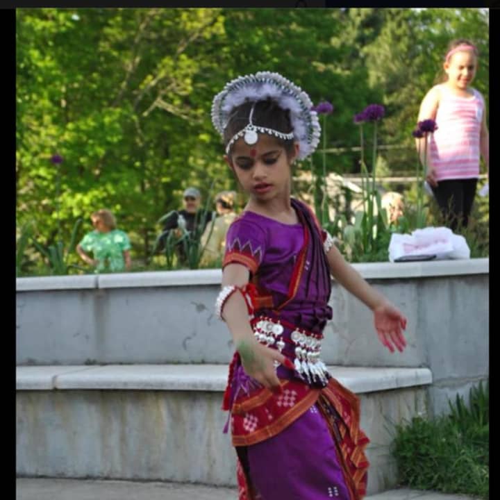 At AIS&#x27; 10 year anniversary celebration in Danbury, a student performs a dance that is part of her family&#x27;s heritage.