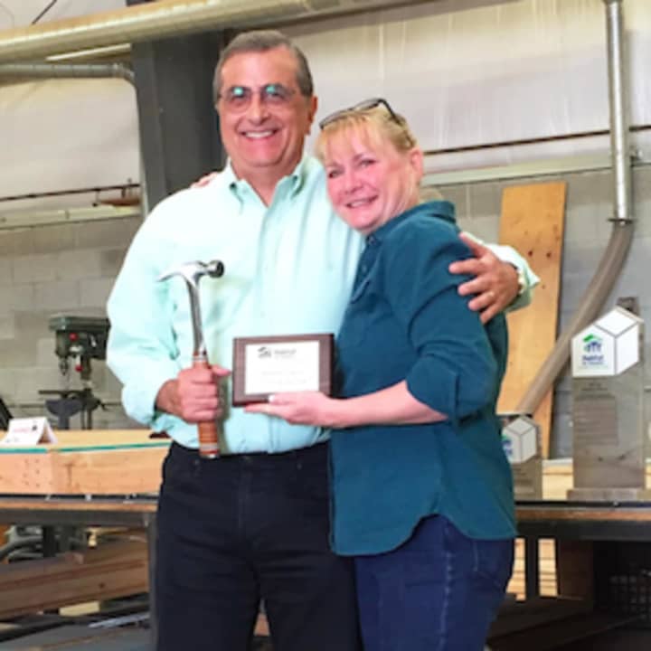 Michael Gallo of Darien was recognized as volunteer of the year for Habitat For Humanity of Coastal Fairfield County. He&#x27;s pictured with Eileen Bakos, manager of Volunteer Services.