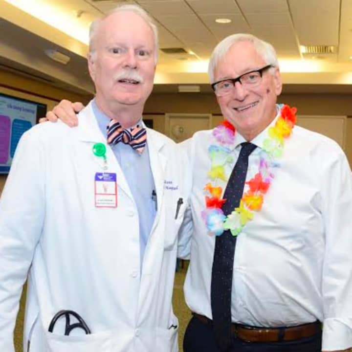 Dickerman Hollister, MD, presented Paul Waters, MD, (right) with the 2016 Oncology Service Line Award at Greenwich Hospital’s “Sailing into Survivorship” celebration, which drew nearly 130 former patients, volunteers and staff.