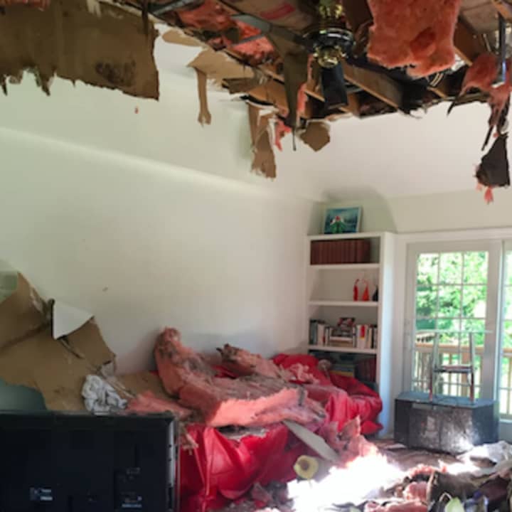 Damage from a fire that started after lightning struck a Thornridge Drive home in Stamford early Tuesday morning. Firefighters had to rip into the room&#x27;s ceiling in order to put the fire out.