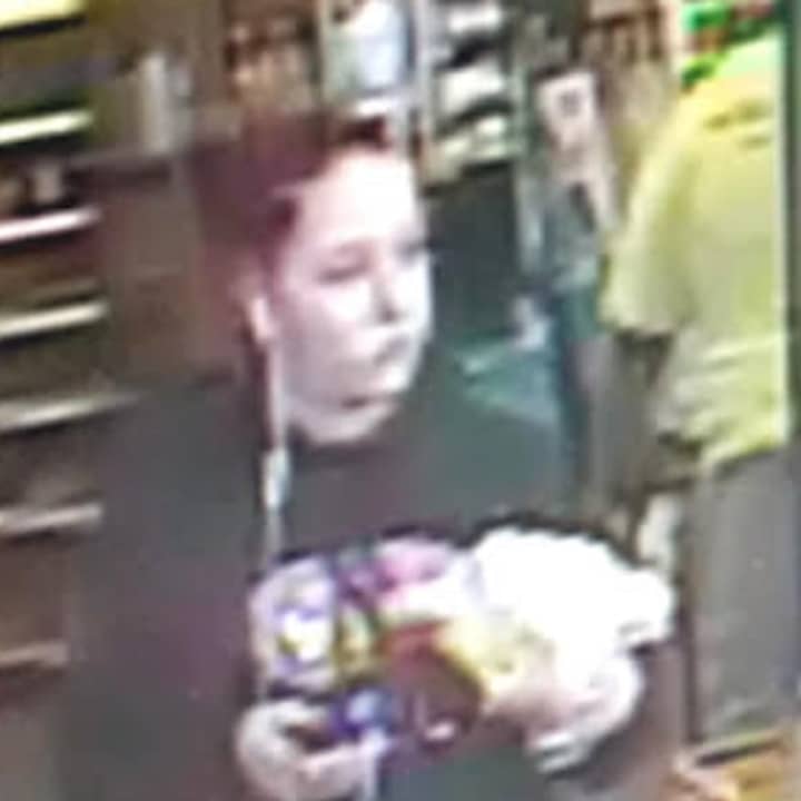 The woman pictured here is a suspect in the theft of a wallet and credit cards from a car parked in Southport.