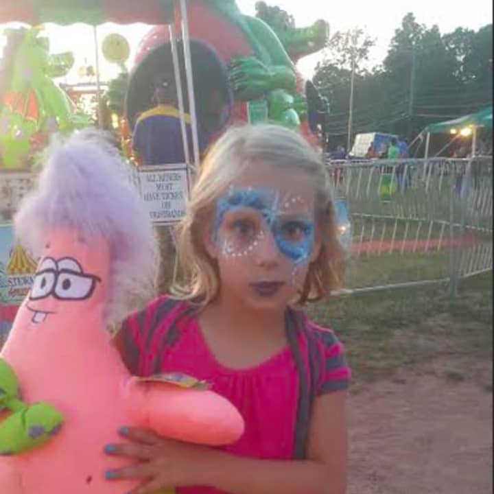 7-year-old Julia Matera won many prizes at New Fairfield&#x27;s Old Tyme Carnival on Tuesday.