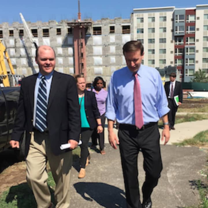 U.S. Sen. Chris Murphy, D-Conn., at right, walking with Stamford State Rep. Dan Fox, D-148th District at the under construction Metro Green III apartments in Stamford.