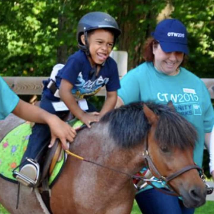 Yee-haw! A youngster takes a pony for a ride at Mahwah&#x27;s Pony Power Therapies.