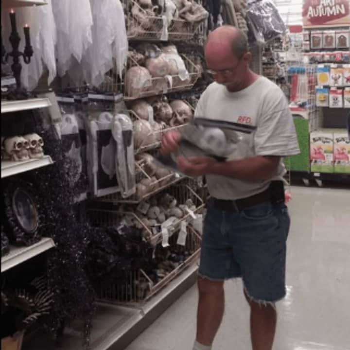 Bill Ackerson spends time in the Halloween section... in August.