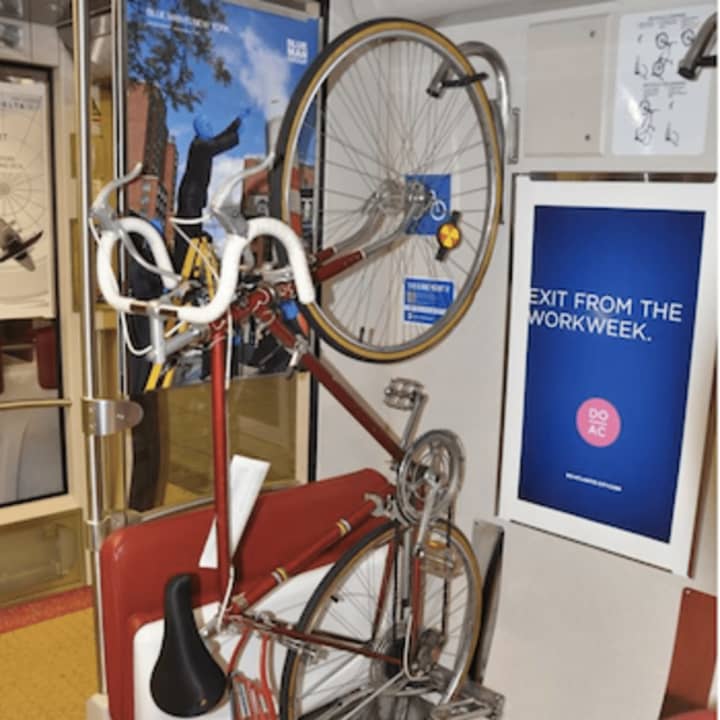 A bicycle on a rack on a Metro-North car.