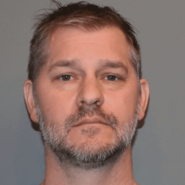 Todd Abbruzzese, 45, of 6 Garden Square, Fairfield is facing weapons charges after police discovered a pair of firearms and knives in his vehicle after he slammed into a utility pole Tuesday afternoon in Norwalk.