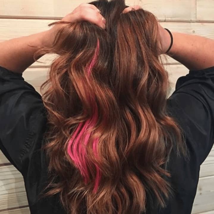 Pink hair extensions are raising breast cancer awareness.
