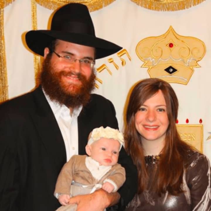 Rabbi Yosef Orenstein with his wife, Estie, and their child, of Valley Chabad in Woodcliff Lake.