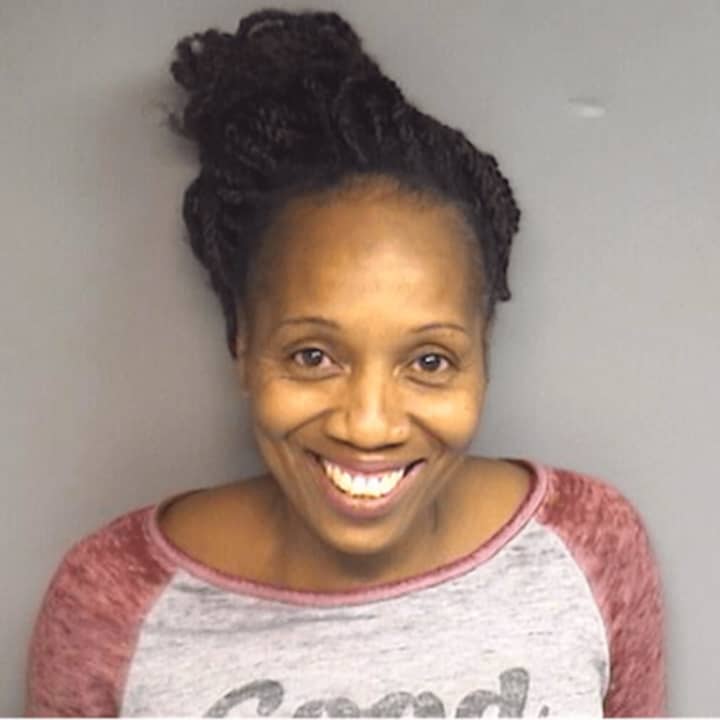 Geneva R. Scates of Stamford is charged with robbery after allegedly struggling with clerks while attempting to steal five bottles of alcohol Thursday night, Stamford Police said.