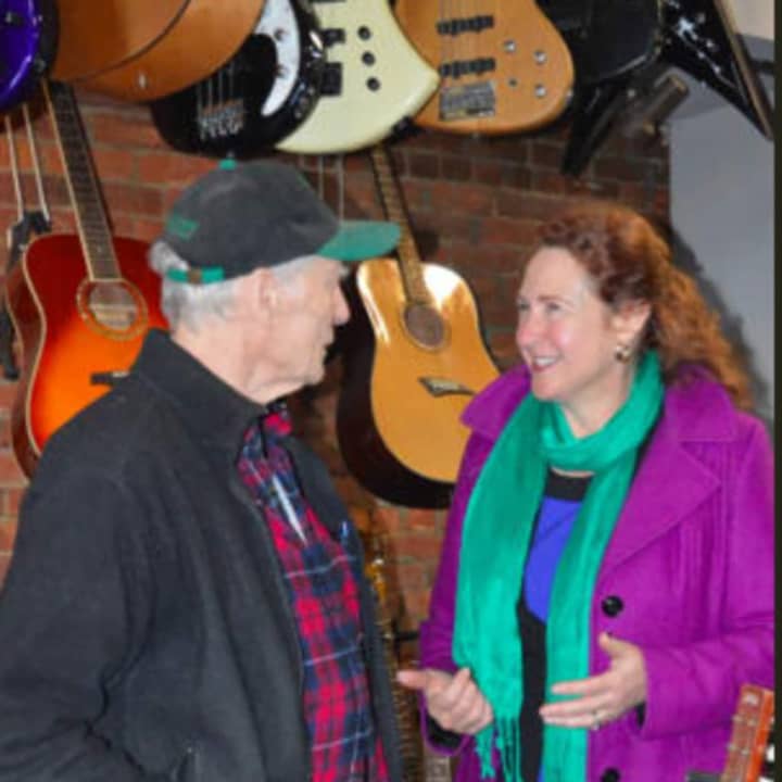 Russ Mumma, owner of the Music Guild in downtown Danbury, speaks to U.S. Rep. Elizabeth Esty (D-5th District) during her small business tour in December.