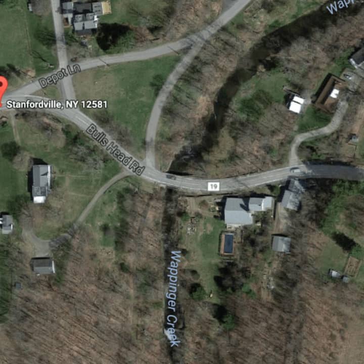 A Stanford woman was killed when her car landed in Wappinger Creek following a crash on Sunday.