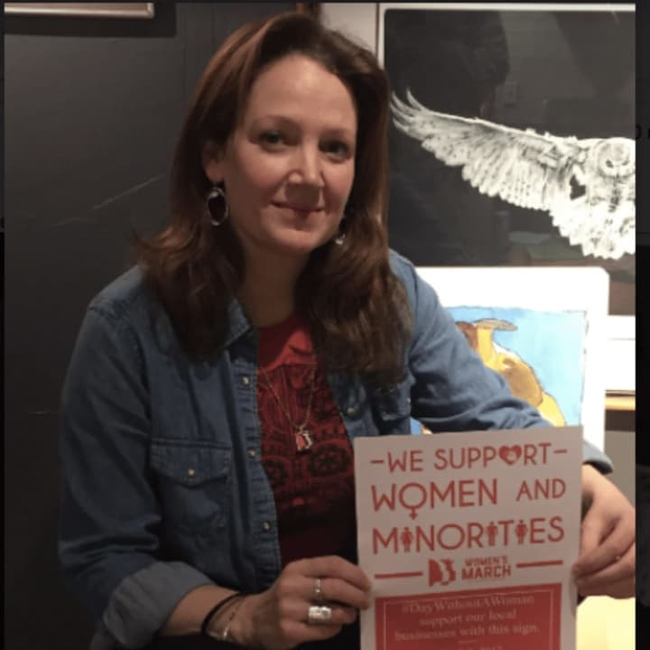 Ridgefield resident Aimee Berger-Girvalo helped print 80 signs and placed them in store windows throughout Ridgefield so women will know which businesses are honoring the Day Without A Woman. The posters were designed by Heather Candullo.