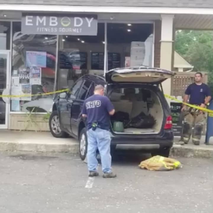 A car crashes into Embody Fitness Gourmet in Darien on Thursday.