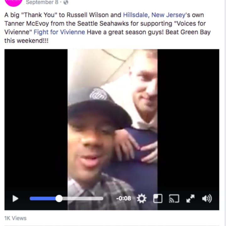 Russell Wilson and Tanner McEvoy of the Seattle Seahawks wish Northvale&#x27;s Vivienne Knopp well.
