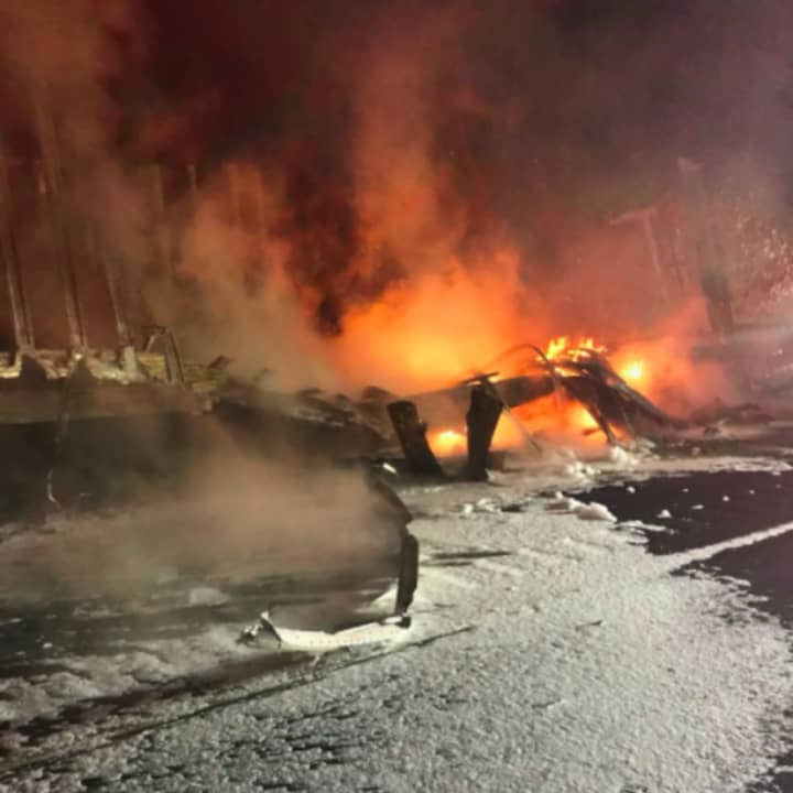 Debris from a fiery crash early Saturday involving two tractor-trailers just past Exit 16 on eastbound on I-84 in Southbury.