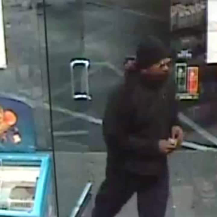New York State Police investigators have released surveillance photos of a suspect implicated in an armed robbery at a Cortlandt gas station.