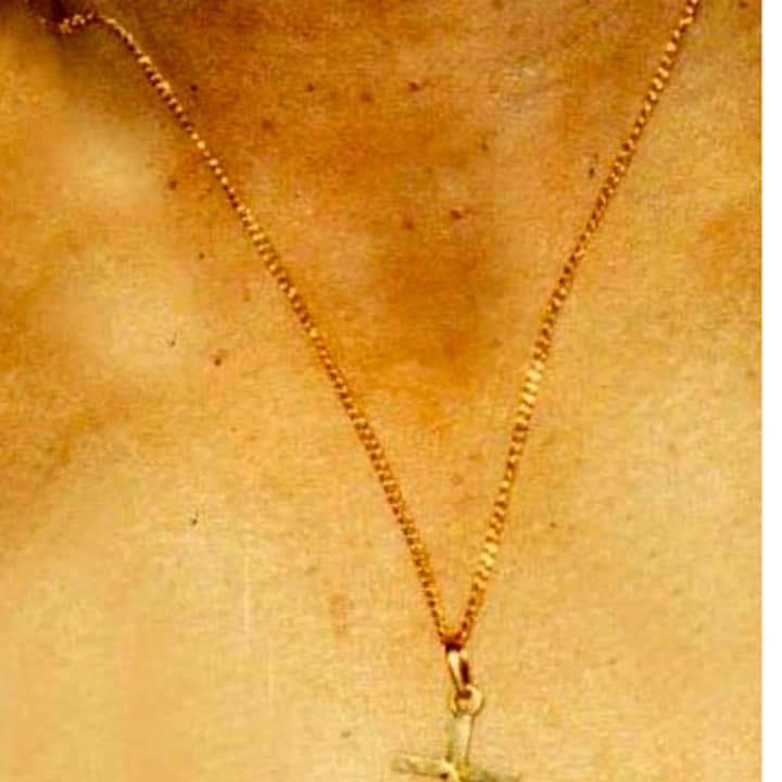 This gold chain with a crucifix was found on the body of a man in a wooded area of Brewster. State police are seeking tips in the 1995 mysterious death.
