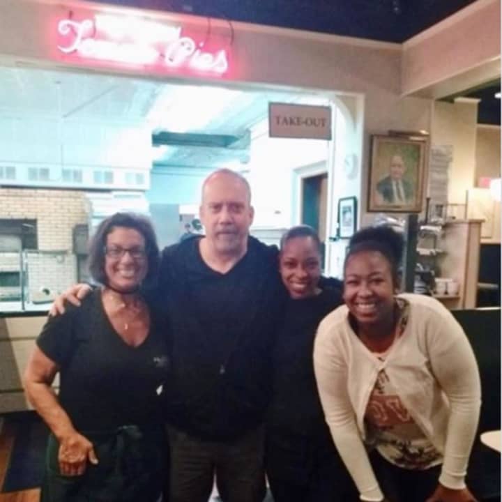 Paul Giamatti poses for this photo at Frank Pepe&#x27;s Pizzeria in New Haven on Saturday night.