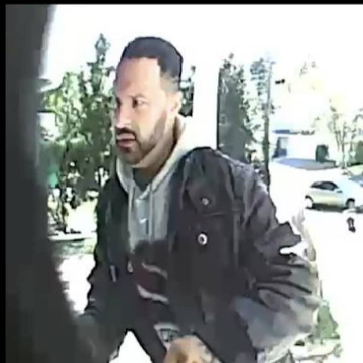One of the suspects who stole packages from a porch.