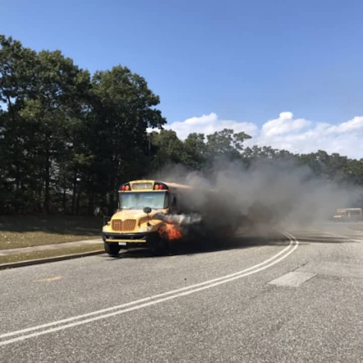 A school bus caught fire on its way to pick up students in Moriches.