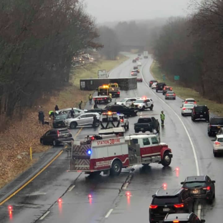 A tractor trailer overturned and several cars behind it crashed Sunday in Warren County.