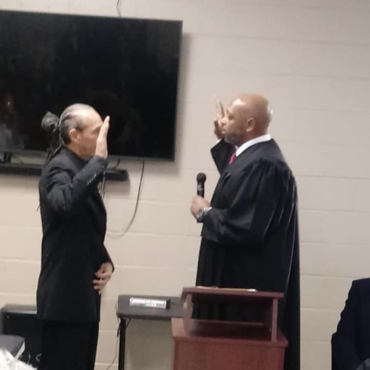 Omari Shakur (left) being sworn in as Newburgh City Councilman in November.