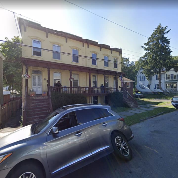 A woman was found dead inside a basement apartment during a three-alarm fire.