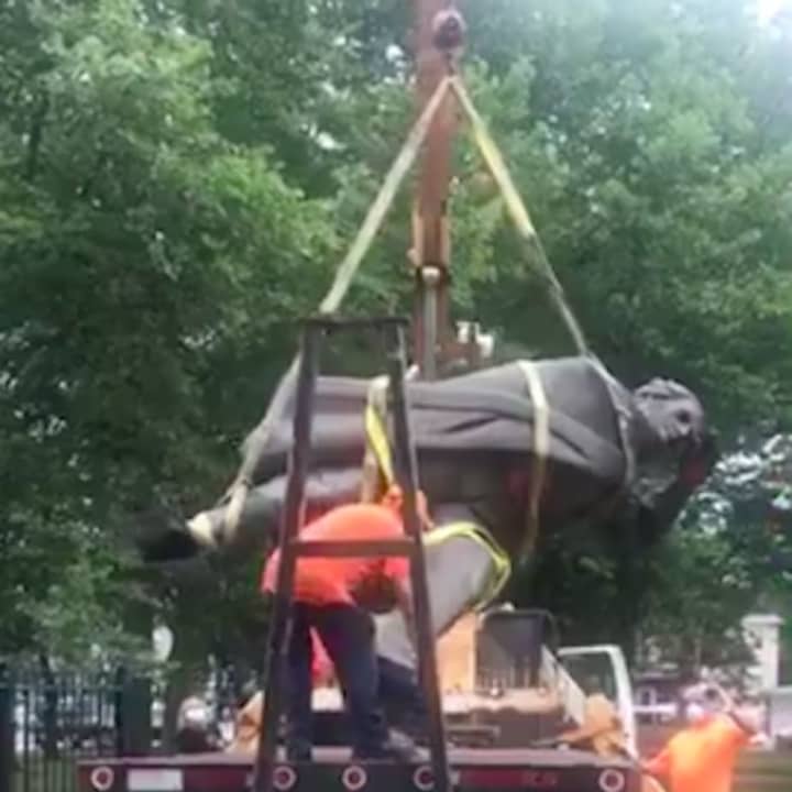 A 60-year-old statue of Christopher Columbus was removed by a Trenton public works crew on Wednesday.
