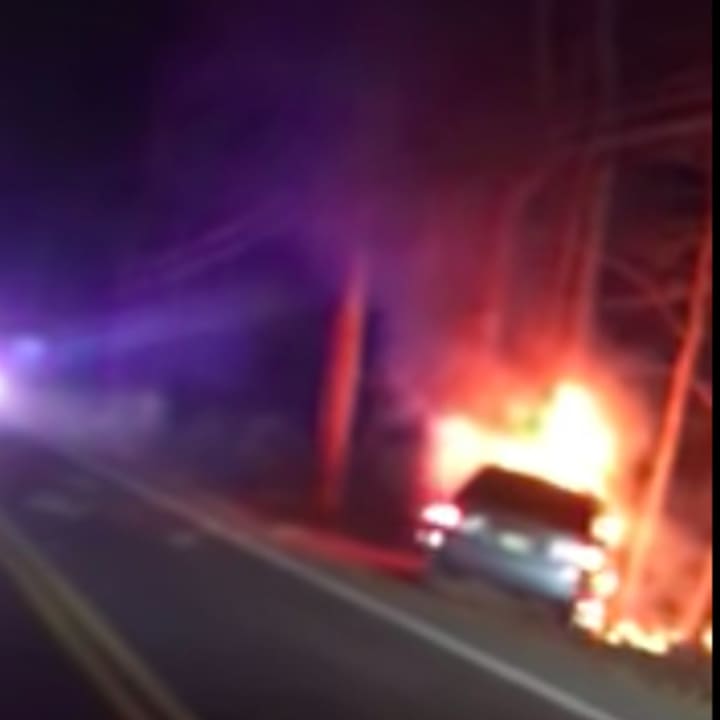 A Howell police officer rescued a driver from this fiery crash.