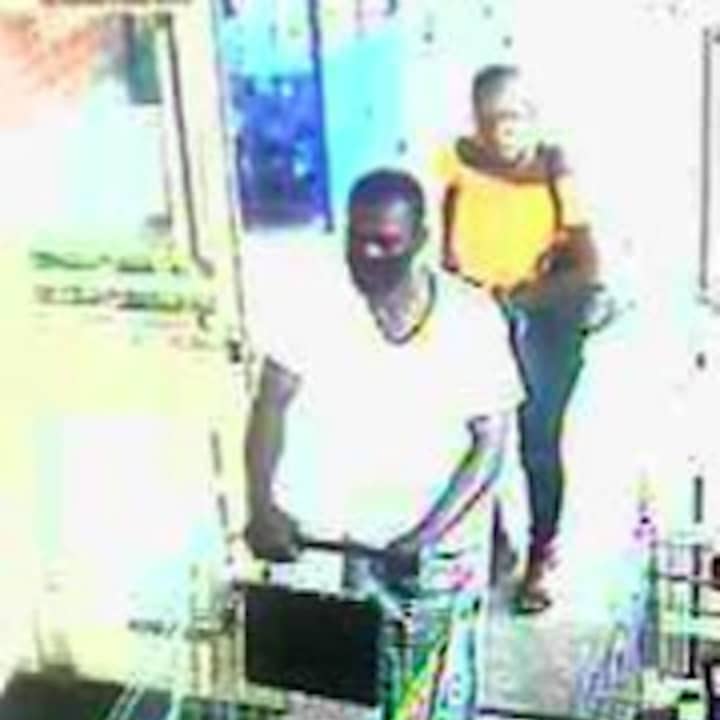 A surveillance still of the wanted pair.