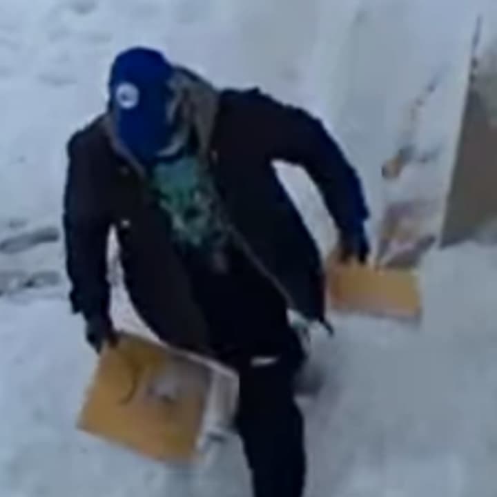 The man was seen snatching two packages from a front porch in the township in the surveillance video posted to the local police Facebook page.