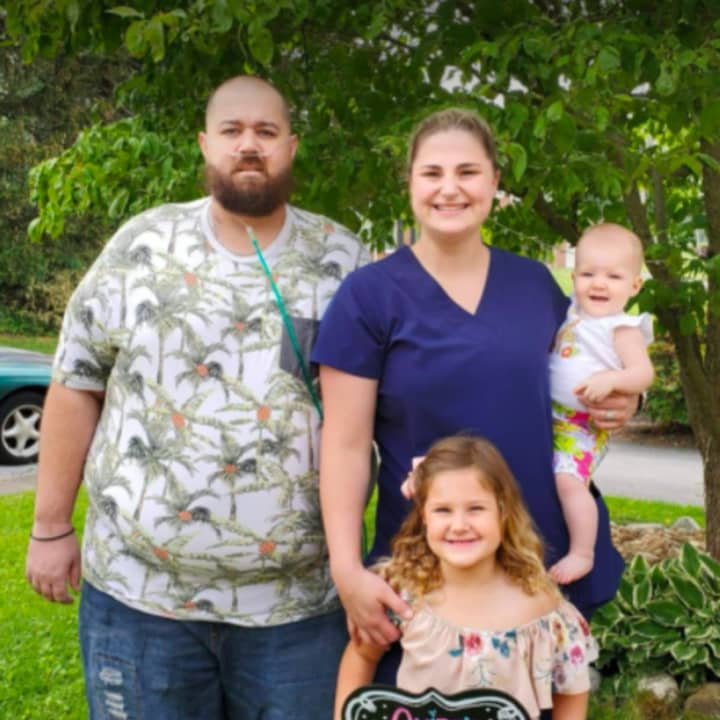 Kyle and Brianna Schriner with their two daughters.