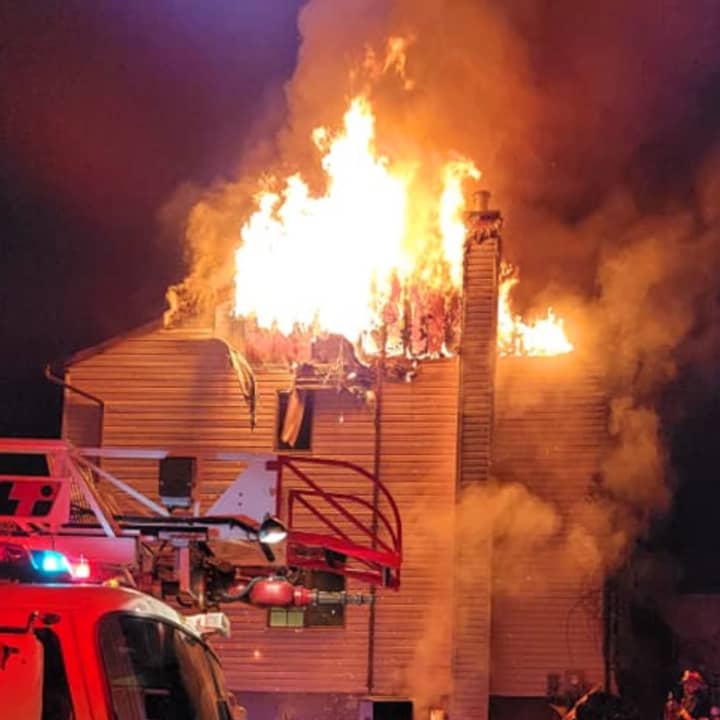 A two-alarm fire tore through and destroyed a Sussex County home late Thursday, authorities confirmed.