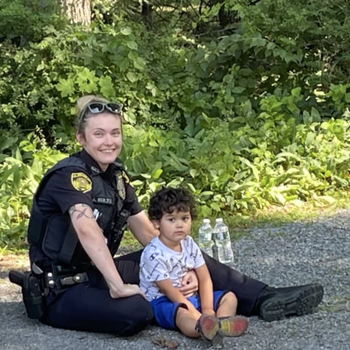 Saugerties Officer Amber Kolts with the child after he was found on Route 9W.