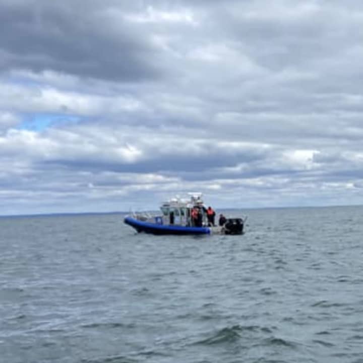 Two Suffolk County Marine Bureau officers rescued two fishermen who went overboard in the Long Island Sound.