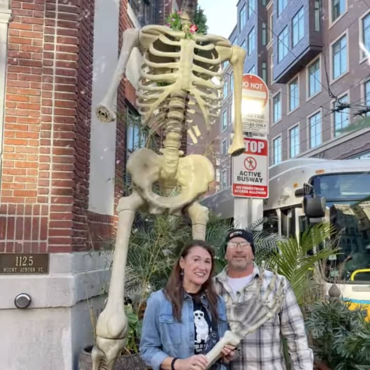 Maria Bennes and her husband gave Wusong Road a new arm for the Harvard Square tiki bar&#x27;s 12-feet-tall Halloween skeleton after someone stole the appendage from the restaurant&#x27;s statue.