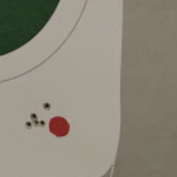 At the top of the photo: East Hartford Police Association President Frank Iacono said he used the Glocks issued to East Hartford police to try to hit the red dot. At the bottom: Iacono said he used a new gun to hit the target - with more success.