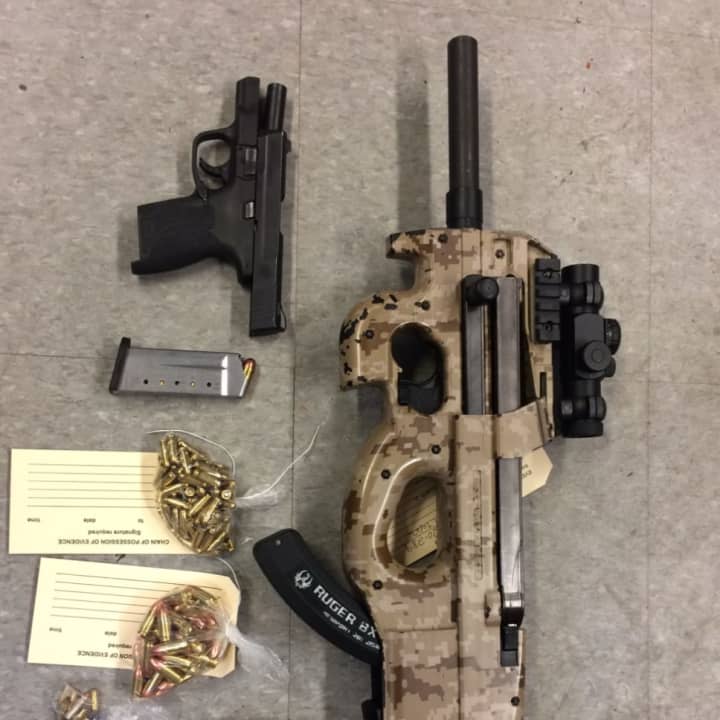 Items police confiscated from the home of a man accused of trying to sell firearms via Snapchat.