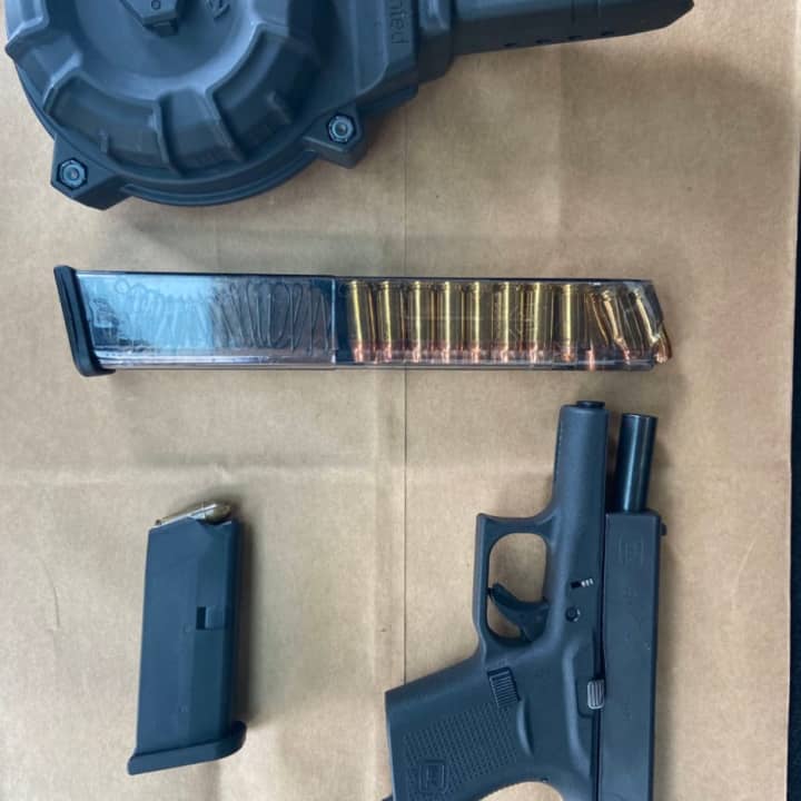 The gun and ammunition pictured here were seized following a lockdown at two Hartford schools. The lockdown was a precaution after a shooter in the area was reported, Sept. 24. Two men are in custody.