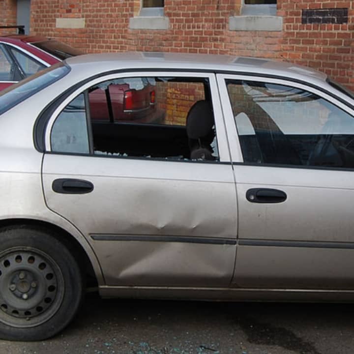 Photo illustration, a vehicle with a broken window
