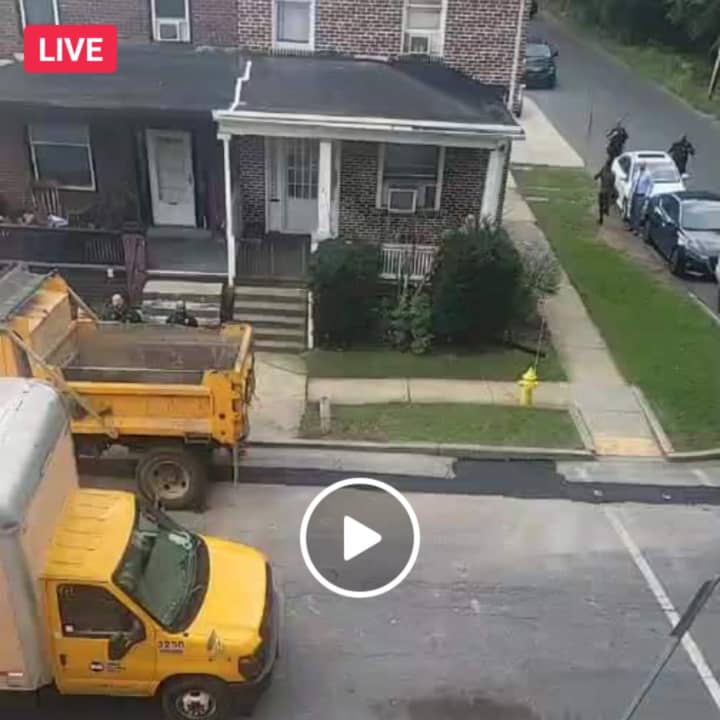 Facebook live video still, which appears to show an active standoff in Harrisburg.