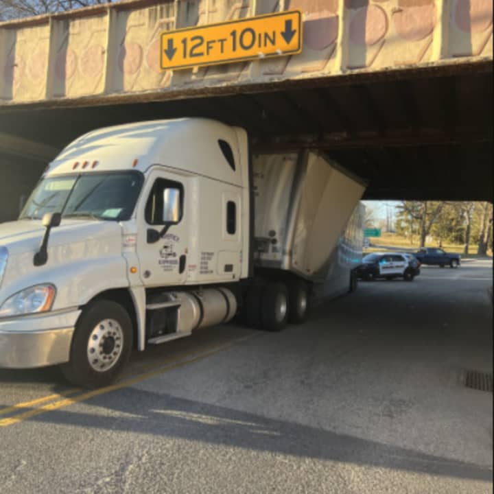 The tractor-trailer wedged under the railroad bridge in Carlisle.