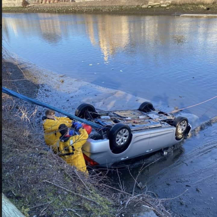 The car being pulled from the water.&nbsp;