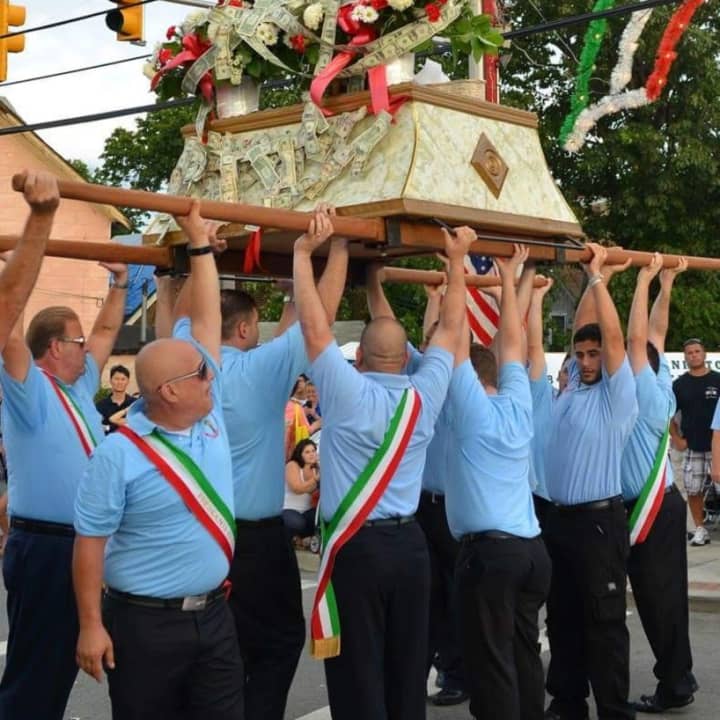 Members carrying the statue of their patron saint.