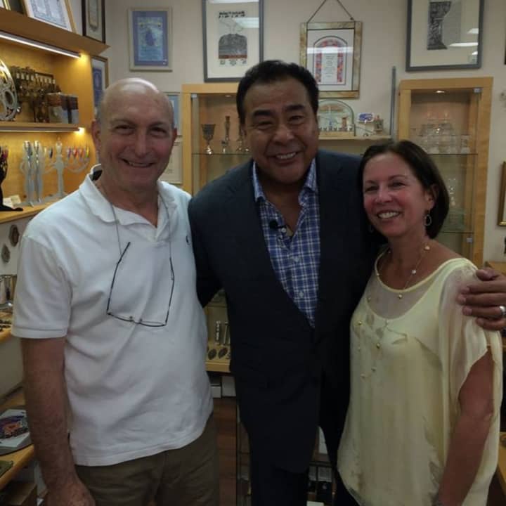 Ruth and Shimon Zimerman posing with news correspondent John Quinones, host of ABC&#x27;s &quot;What Would You Do?&quot;